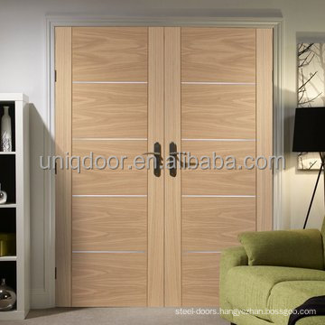 Oak veneered double wood door with aluminum inlay